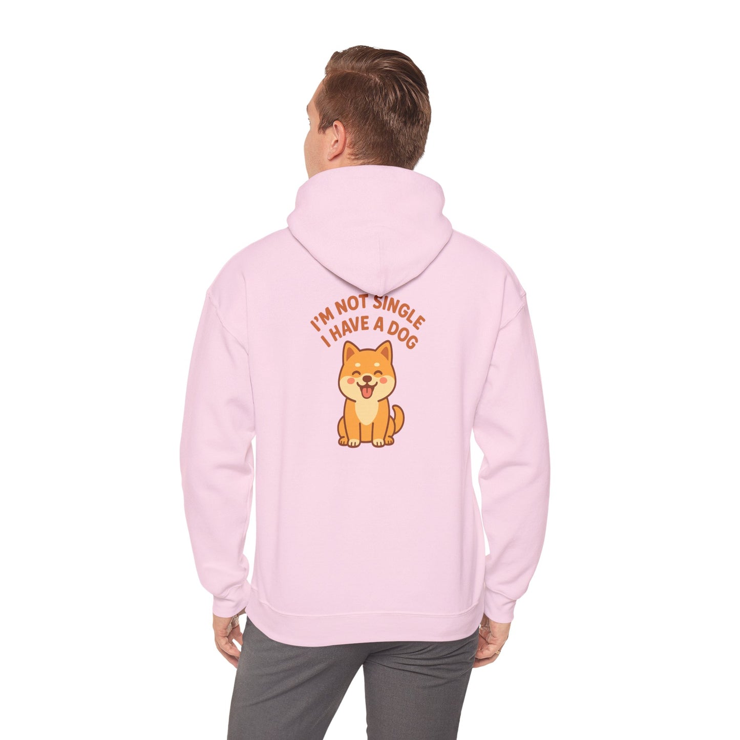 Person wearing a pink hoodie with a dog graphic and text on the back, on a white background