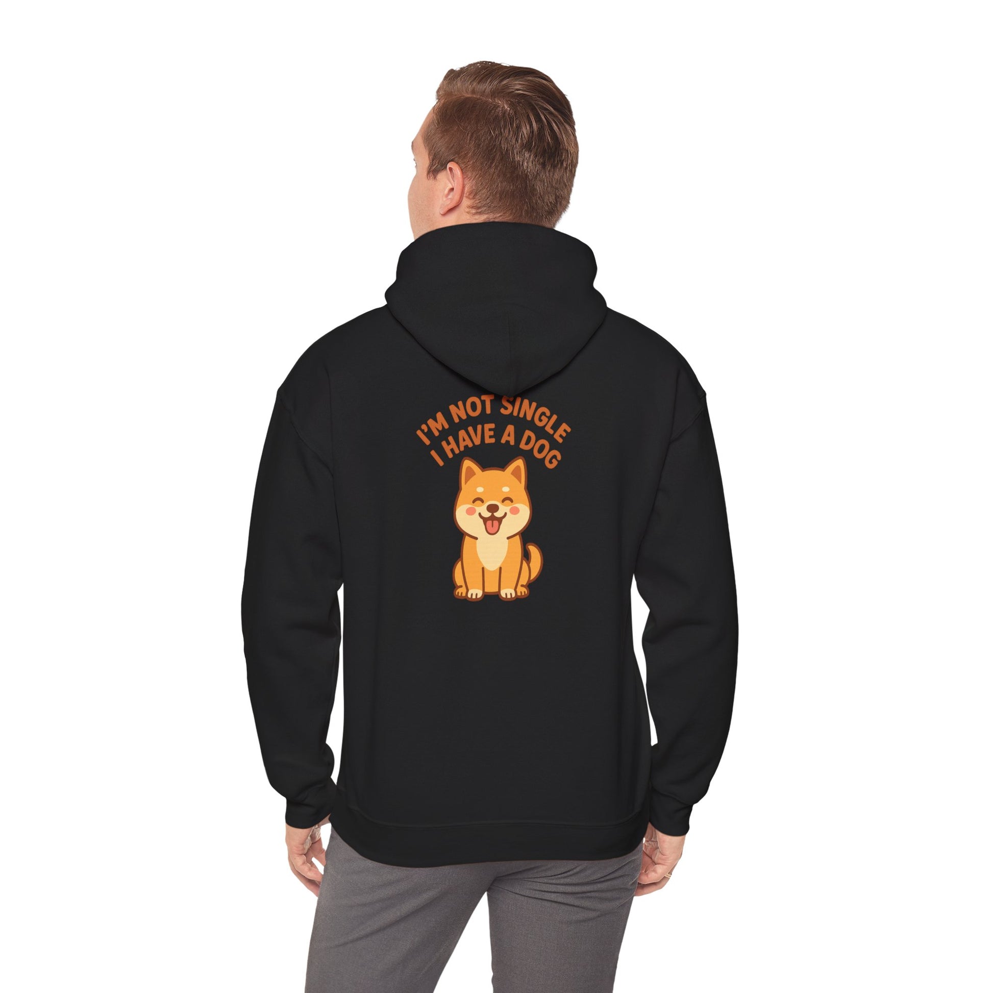 Person wearing a black hoodie with a dog graphic and text on the back